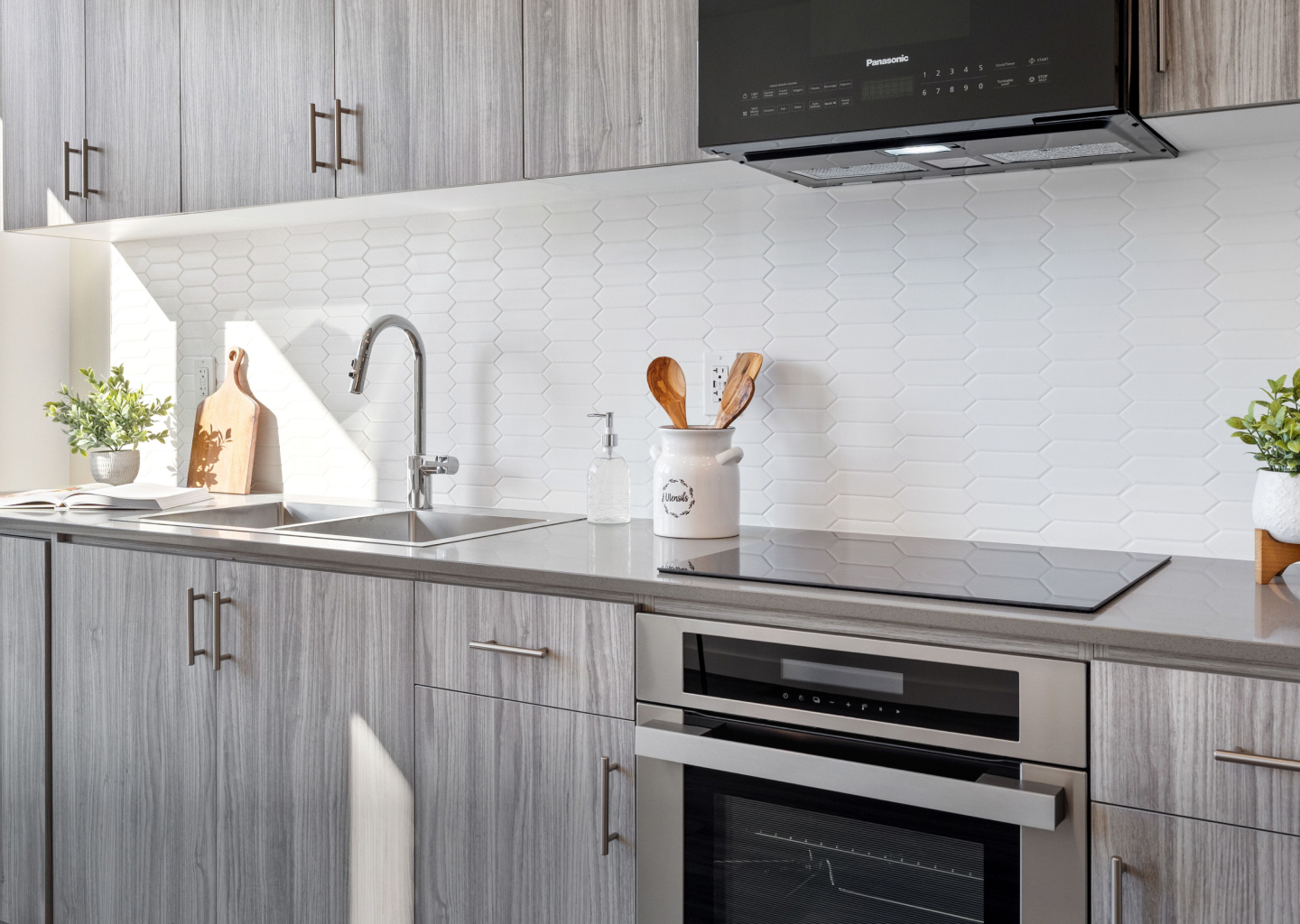 Modern kitchen with designer cabinetry and quartz countertops