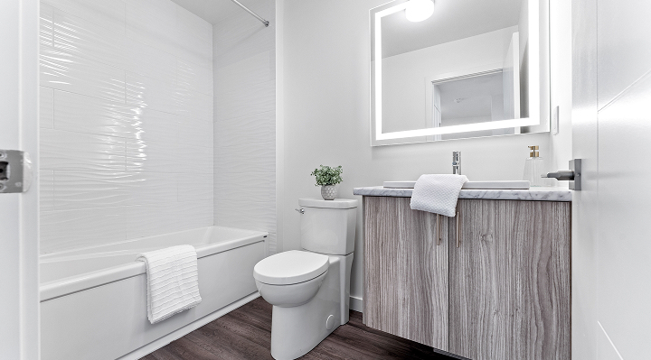 Bright bathroom with white subway tile and contemporary vanity